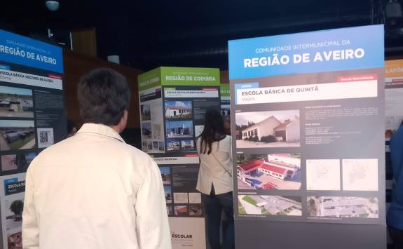 A man browses signs at a conference